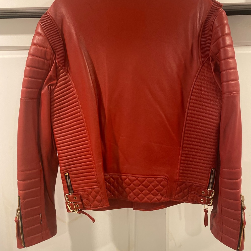 LIMITED* Boda skins Kay Michael’s biker leather jacket with gold hardware.